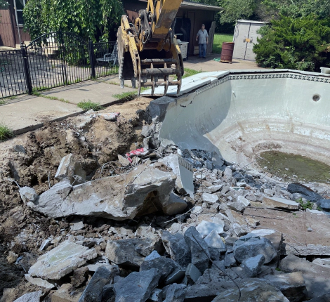 excavator demolishing a swimming pool wichita ks